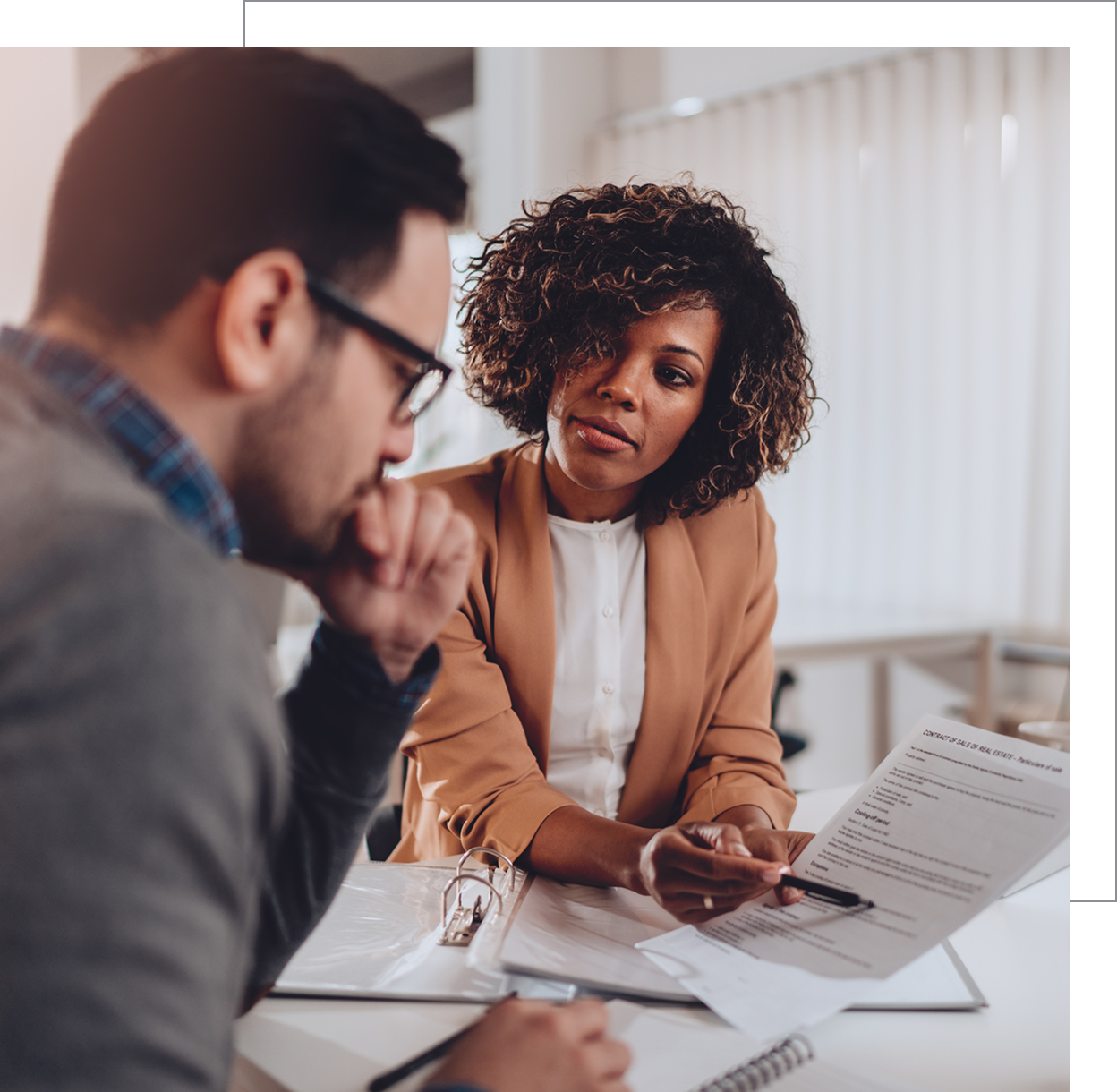Business discussion with documents in office