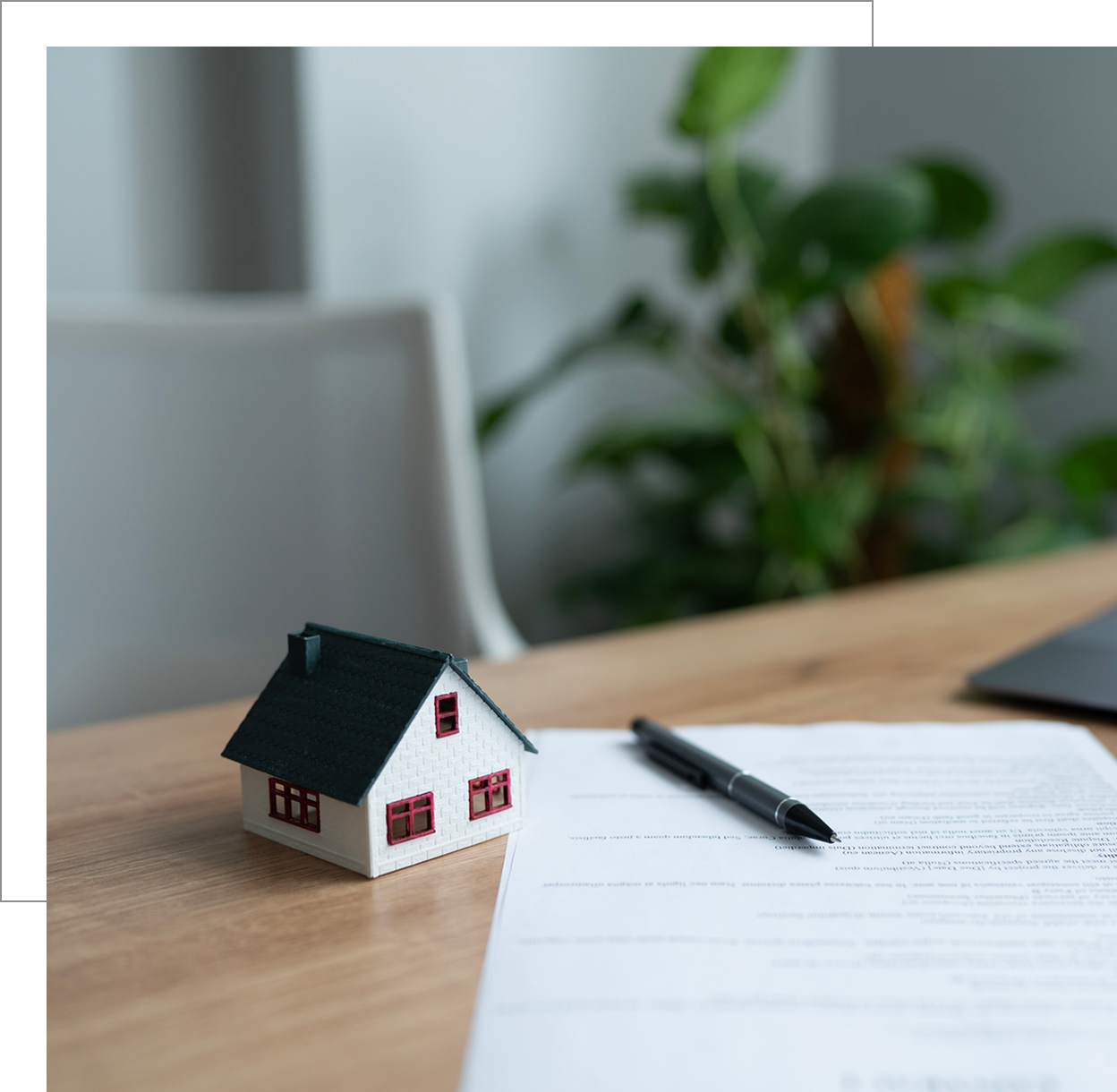 Real estate contract with small house model