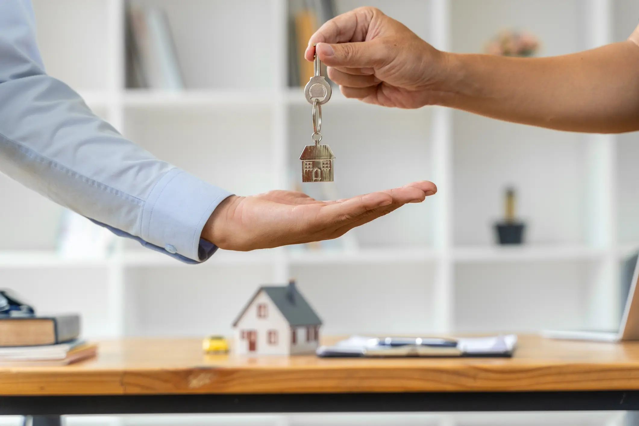 Real estate transaction with house keys