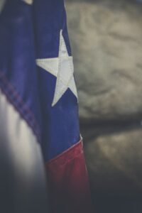 A close up of a texas flag.