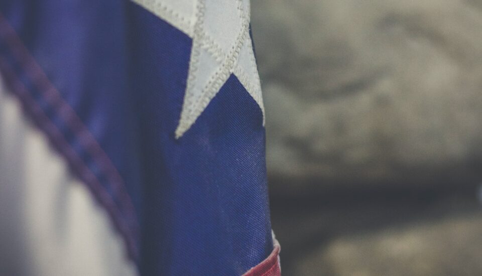A close up of a texas flag.