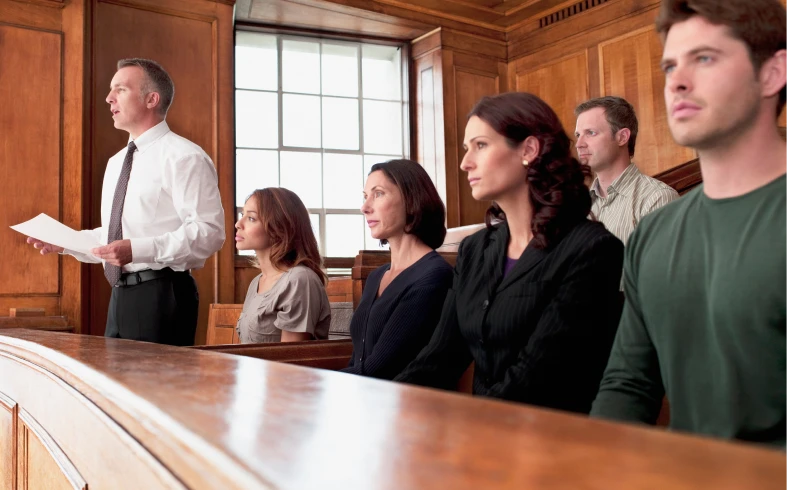 People seated in a courtroom