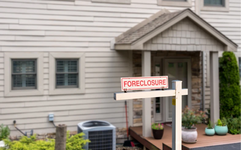House with foreclosure sign outside