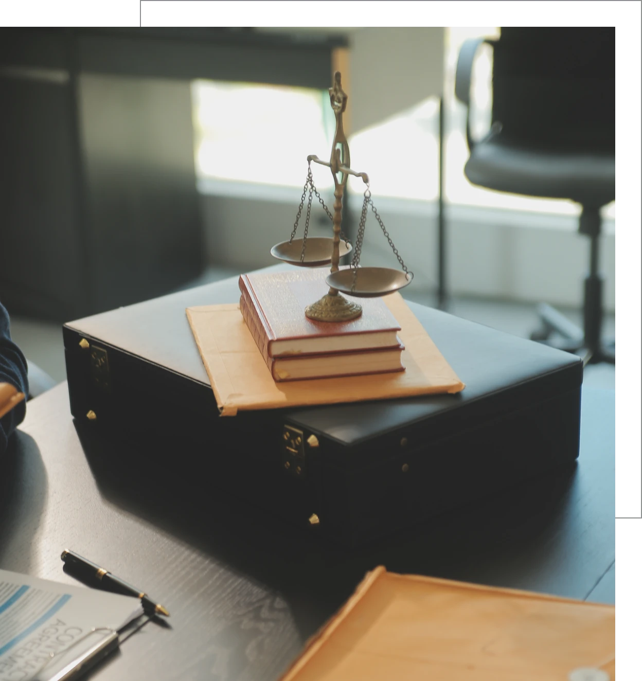 Office desk with legal scales and pen