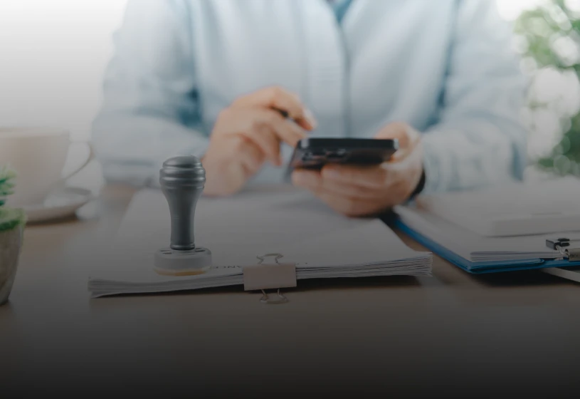 Person working with documents and stamp