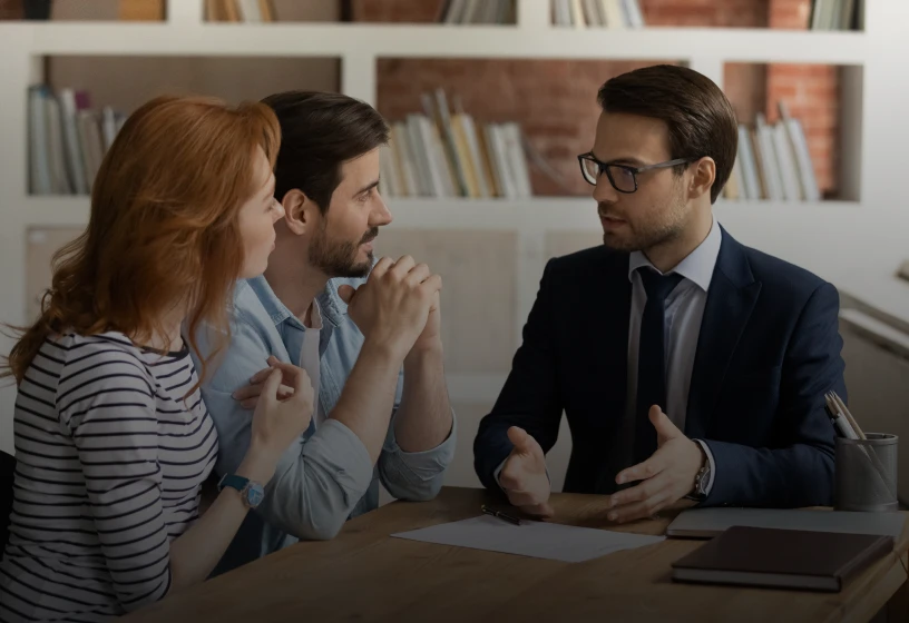 Professional advising a couple at the table