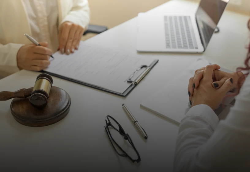 Lawyer consulting client with documents