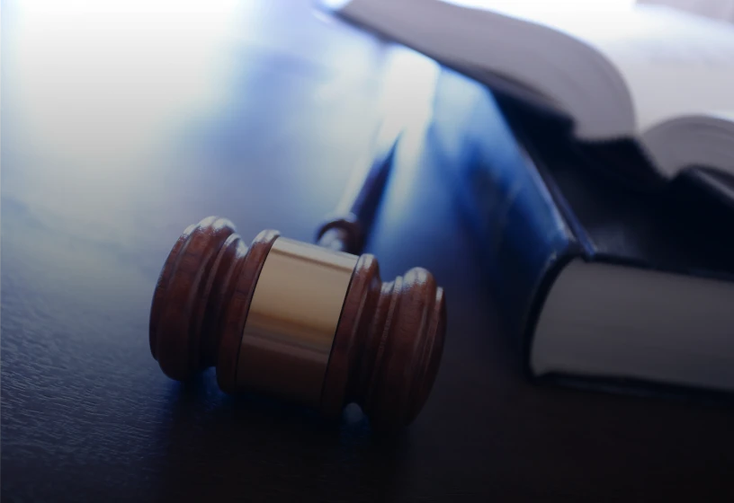 Wooden gavel on dark table